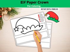 the elf paper crown for coloring is being held by a hand