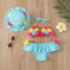 This adorable two-piece floral swimsuit with a hat set is essential for every girl's wardrobe. Complete with a matching hat, this swimsuit is sure to keep her cool in the summer heat. Material: Polyester Toddler Bathing Suits, Halter Swim Top, Baby Swimsuit, Mommy And Me Dresses, Baby Swimwear, Newborn Boy Clothes, Funny Baby Onesies, Floral Swimsuit