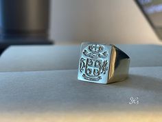 "xl solid gold family crest signet rings delicately engraved with your family crest or any other initials or image you want ♡ the ring has solid back. deep and detailed engraving very delicately handcrafted unisex - looks super cool on both women & men side or inside engravings cost 12 USD for both sides. please contact us if you request side engravins or simply go back to our shop and purchase the \"Side or inside engraving fee\" listing. available in xl square face 17x19 mm xl oval face 18x18 Luxury Signet Ring With Classic Design, Luxury Engraved Ring With Classic Design As Gift, Luxury Classic Design Signet Ring, Luxury White Gold Engraved Signet Ring, Luxury Rings With Coat Of Arms For Gift, Luxury White Gold Hallmarked Signet Ring, Luxury Signet Ring With Coat Of Arms For Anniversary, Luxury White Gold Signet Ring With Hallmarks, Luxury Men's Signet Ring For Commemoration