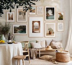 a living room filled with lots of pictures on the wall above a couch and table