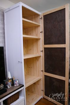 a living room with a tv and wooden shelves