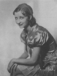 an old black and white photo of a woman