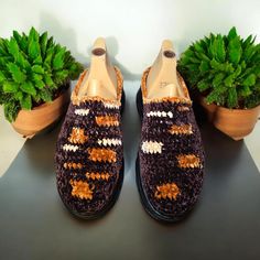 These unique, handcrafted crochet shoes feature a blend of deep brown, cream, and beige yarns, offering a warm and earthy aesthetic. The soft, velvet-like texture provides both comfort and style, making them perfect for casual wear. The intricate crochet pattern adds a personalized, artistic touch to the shoes, while the sturdy sole ensures durability and support for daily wear. Ideal for those who appreciate craftsmanship and sustainable fashion, these crochet shoes stand out with their cozy feel and eye-catching design. Crochet Outdoor, Crochet Unique, Womens Loafers, Earthy Aesthetic, Intricate Crochet, Shoes Stand, Crochet Shoes, Deep Brown, Soft Velvet