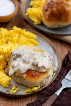 a plate with eggs and biscuits on it