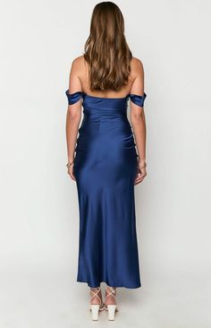 Navy Off Shoulder Formal Maxi Dress

How to style:
Turn heads in our stunning Ella navy off shoulder maxi dress (). This piece is the perfect option for your next formal event whether it be homecoming, a birthday, or graduation! Pair this elegant dress with nude heels () and a simple clutch. To enhance the look, add some gold jewellery ()!

Features:


  
 * Light weight satin material
 
 * Maxi length
 
 * Slight stretch
 
 * Bias cut
 
 * Off the shoulder style
 
 * Lined bust 
 * Invisible zip on left side
 
 * Grip on inner bust Chic Off Shoulder Floor-length Prom Dress, Chic Off-shoulder Floor-length Dress For Prom, Satin Maxi Dress For Homecoming, Chic Floor-length Off Shoulder Prom Dress, Chic Floor-length Off-shoulder Prom Dress, Satin Maxi Length Evening Dress For Homecoming, Satin Maxi Evening Dress For Homecoming, Off-shoulder Satin Maxi Dress For Formal Occasions, Blue Off Shoulder Maxi Dress For Party