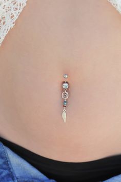 "A one of a kind belly button ring full of boho-chic style! Handmade of a Silver barbell, dreamcatcher and feather pendants, and Swarovski crystal beads. Quality meets style for the hottest look out there! Do not hesitate to contact me for special requests and customization! ♥♥ ▶ Sterling Silver curved barbell, 11 mm long (not including the barbells) a universal fit. ▶ Swarovski faceted crystal beads- Blue, green and red color ▶Silver dreamcatcher and feather pendants, 4 cm (1.57 inches) long (m Bohemian Belly Rings As A Gift, Bohemian Handmade Belly Rings For Gifts, Bohemian Handmade Belly Rings As Gifts, Bohemian Internally Threaded Body Jewelry As Gift, Handmade Dream Catcher, Silver Pearl Ring, Handmade Dreamcatcher, Navel Ring, Swarovski Beads