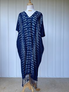 You will look fabulous in this truly unique hand made kaftan from hand woven (with hand woven pattern!) and hand dyed thread. The kaftan feels as good as it looks with soft and graceful drape. Pefect for evening wear, events and out and about it is made with care and long lasting quality. Traditional V-neck Kaftan With Tassels, Oversized Blue Bohemian Tunic, Blue Ikat Print Kaftan For Summer, Bohemian Kaftan With Ikat Print And Kimono Sleeves, Indigo Bohemian Dress With Natural Dye, Summer Blue Ikat Print Kaftan, Bohemian Blue Kimono With Natural Dye, Blue Bohemian Kimono With Natural Dye, Traditional V-neck Kaftan With Ikat Print