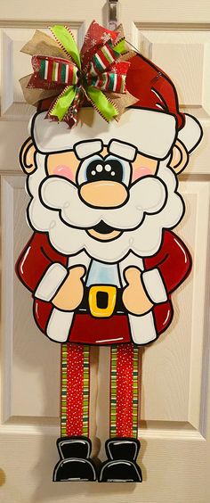 a door hanger with a santa clause on it