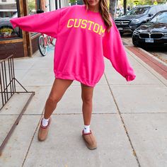 Customize your sweatshirt with the city, state, (or whatever you want!) with a yellow design on a cozy bright pink sweatshirt! We love the preppy aesthetic and of course, the pink! Sizing of the wording will vary based on the length of the word chosen. If you have questions about your custom design idea, reach out to us! ♥ Our unisex heavy blend crewneck sweatshirt is pure comfort. These garments are made from polyester and cotton. This combination helps designs come out looking fresh and beauti Pink Casual Sweater For College, Casual Pink Sweater For College, Oversized Pink Sweater For Streetwear, Pink Crew Neck Sweats For Spring, Pink Spring College Sweatshirt, Pink Sweatshirt For College In Spring, Pink Spring Sweatshirt For College, Pink Casual Sweats For Streetwear, Casual Pink Sweats For Streetwear