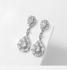 BEST SELLER Our newest addition, they are perfection, elegant, classy, tradition yet glamorous. Beautiful elegant simulated diamond crystal drop earringsThe perfect set for the elegant bride or perfect for any special event.approx 1 1/4" long pierced *Note processing time is not shipping time, our regular Free shipping takes approx. 5-6 days to receive after shipped. With rush processing your order is expedited and you will also be upgraded to priority mail approx 2-3 days to arrive once shipped Bridal Drop Earrings, Bridal Earrings Drop, Elegant Bride, Crystal Drop Earrings, Crystal Drop, Diamond Crystal, Best Seller, Special Event, Priority Mail