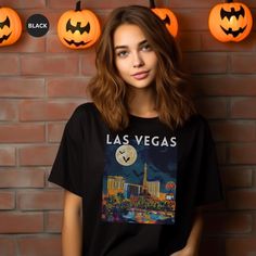 Celebrate Halloween with this Las Vegas Halloween theme T-Shirt.  Makes a great gift. This classic unisex jersey short sleeve tee fits like a well-loved favorite. Soft cotton and quality print make users fall in love with it over and over again. These t-shirts have-ribbed knit collars to bolster shaping. The shoulders are tapered for a better fit over time. Dual side seams hold the garment's shape for longer. .: Made with 100% Airlume combed and ring-spun cotton, a lightweight fabric (4.2 oz/yd² Halloween Vegas, Vegas Halloween, Las Vegas Halloween, Halloween Theme, Prism Color, Halloween Gift, Leisure Wear, Halloween Shirt, Halloween Themes