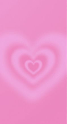 a pink background with a heart shape in the center