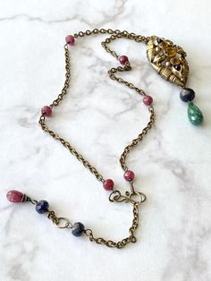 1940s Glass Topaz Vintage Brooch Necklace with Rubies and Sapphires Vintage Jeweled Oval Necklace, Vintage Oval Jeweled Necklaces, Vintage Oval Jeweled Necklace, Vintage Oval Gemstone Necklace, Antique Jeweled Jewelry For Vintage Events, Vintage Jeweled Necklace For Vintage Events, Vintage Gemstone Jewelry For Jewelry Making, Vintage Multicolor Gemstone Beads And Cabochons, Collectible Vintage Jeweled Jewelry