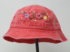 Item: flower embroidered bucket hat Material: 100% cotton Size: one size fits most Embroidery: hand made with acrylic thread Free first class shipping, upgradable priority mail service. 30 days return policy, feel confident at your purchase! Cotton Sun Hat With Short Brim For Spring, Cotton Short Brim Sun Hat For Spring, Brimmed Hats With Embroidered Logo For Spring, Red Cotton Bucket Hat For Spring, Pink Cotton Bucket Hat For Spring, Spring Cotton Bucket Hat With Curved Brim, Adjustable Cotton Hats For Spring, Adjustable Cotton Spring Hats, Bohemian Cotton Hat For Spring