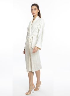 Wrap yourself in pure Bliss with our Angel White Long Robe. This luxurious robe is adorned with soft, angelic flower swirls and made of absorbent microfiber, making you feel like a true angel. Experience the ultimate comfort and indulgence with our Bliss robe. One size Long bath/lounge Robe Shawl collar 2 bottom side pockets Belt loops/removable waist tie closure Made of soft and absorbent microfiber Machine wash cool Tumble-dry low Elegant Silk Sleepwear For Relaxation, Elegant Cream Sleepwear For Loungewear, Elegant Cream Sleepwear, Elegant White Robe For Relaxation, Elegant White Sleepwear For Relaxation, Elegant Cream Robe For Daywear, Feminine Cream Robe For Loungewear, Long Bath, Lounge Robes