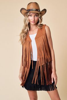 Introducing our Maple Fringed Vest! A versatile and stylish addition to your wardrobe. Crafted with soft, lightweight fabric, this vest offers both comfort and style for any occasion. The fringe detailing along the hem adds a bohemian touch, while the open-front design allows for easy layering. Elevate your outfit with this chic vest that's perfect for adding flair to any look. Soft and lightweight fabric for all-day comfort Fringe detailing along the hem adds a bohemian flair Versatile open-fro Chic Open Front Fall Vest, Summer Bohemian Outerwear With Frayed Hem, Trendy Summer Outerwear With Fringe, Sleeveless Outerwear For Summer Festivals, Summer Festival Sleeveless Outerwear, Bohemian Vest Outerwear For Fall, Bohemian Sleeveless Outerwear For Spring, Bohemian Sleeveless Vest For Day Out, Bohemian Fringe Outerwear For Summer