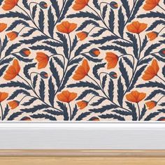 an orange and blue floral wallpaper with white trim in a wooden frame on a beige background