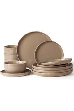 a set of beige dinnerware on a white background