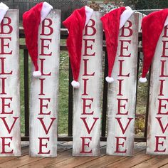 three wooden signs with santa hats on them that say believe and be bellieve