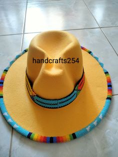 This listing is for beaded edge and brim fedora hat. The beads go around the whole edge and brim. Most hat brims are one size fits all.I have made a beautiful pattern that goes all round. Instead of having a plain fedora hat, this one is more beautiful with beads. Band height is 1 inch Circumference 57cm Beaded Wide Brim Fedora For Festivals, Wide Brim Beaded Fedora For Festival, Festival Beaded Fedora With Flat Brim, Artisan Beaded Fedora Hat, Beaded Caps, Beaded Hats, Beaded Ideas, Beaded Hat Bands, Jazz Hat