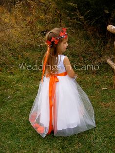 "WEDDINGS IN CAMO.com FALL flower girl dress.Leaves or flowers inside tulle skirt with colored satin sash. EXAMPLES Shown in DUCK BLIND Camo top with chocolate brown sash and ivory skirt OR white with orange sash and leaves OR MC2 PURPLE with Ivory. Hemline is floor length. NOTE--Leaves can be substituted with flowers. Make a note when you order for your colors Many colors are available. Contact us early so we can match your wedding colors. This listing has some of the most popular color options Fall Flower Girl, Fall Flower Girl Dresses, Country Flower Girls, Flower Girl Dresses Country, Harvest Wedding, Orange Wedding Themes, Wedding October, Halloween Themed Wedding, Boda Mexicana