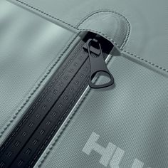 a close up of a pair of scissors on the side of a jacket with zippers