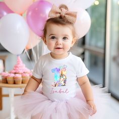 Celebrate your child's special day in style with our Personalised Birthday T-shirt: Unicorn Cake Party Numbers edition. This adorable shirt combines all the elements of a perfect birthday celebration--unicorns, cake, and of course, age numbers! Available in sizes ranging from UK 1 year to 10 years, you can easily find the perfect fit for your birthday child. Crafted with their comfort in mind, our T-shirt ensures a soft and cosy feel against their skin, allowing them to enjoy their special day w Unicorns Cake, Unicorn 1st Birthday Family Shirts, T Shirt Unicorn Birthday, Cute Unicorn Print Birthday T-shirt, Birthday White T-shirt With Unicorn Print, Cake Party, Turning One, Affordable Pink Unicorn Print T-shirt, Unicorn Cake