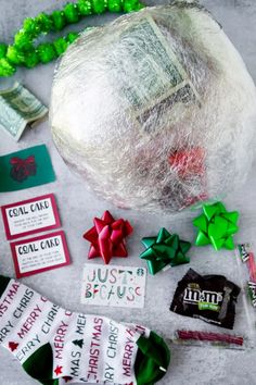 some candy is laying on the ground next to christmas candies and other holiday decorations