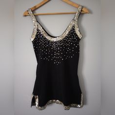 Get Ready To Shine At Your Next Party With This Stunning Black Sleeveless Top From Dolce Cabo. The Top Features Beautiful Sequin Accents That Add A Touch Of Glamour To Your Outfit. Made Of High-Quality Polyester Material, This Regular-Fit Top Is Comfortable To Wear All Year Round And Is Perfect For Any Season. Brand Dolce Cabo Tank Top Sleeveless Color Black Sequin Pull On Pre Owned Excellent Condition Size Small Solid With Sequin 100% Polyester Armpit To Armpit 15 Inch Shoulder To Down 27 Inch Black Glitter Bodysuit, Unique Tops, Metal Tank Top, Work Tank Tops, Serena Van Der Woodsen, Black Sleeveless Top, Sequin Tank Tops, Black Sleeveless, Sequin Top