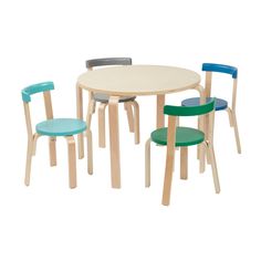 three children's chairs and a table with one child's chair in the middle