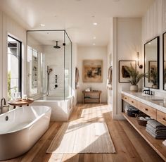 a large white bath tub sitting next to a wooden floor