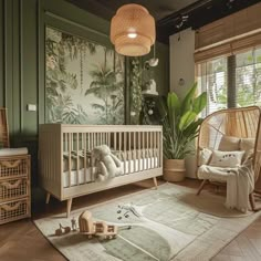 a baby's room is decorated in green and white with palm trees on the wall