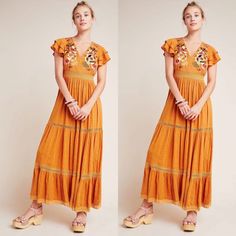 Embroidered Florals And A Striking Golden Hue Make This Maxi Dress An Occasion-Ready Essential - Just Add Heels And A Clutch. Viscose Embroidered Bodice Lace Trim Flutter Sleeves V-Neck Tiered Maxi Silhouette Side Zip Hand Wash Imported Dimensions Falls 55.25" From Shoulder New With Tags Very Good Condition Authentic Line Thru The Tag Is To Prevent Store Returns Bohemian Maxi Dress With Floral Embroidery For Brunch, Embroidered V-neck Maxi Dress For Brunch, V-neck Embroidered Maxi Dress For Brunch, Embroidered Maxi Dress For Brunch, Orange Embroidered Short Sleeve Dress, Yellow Bohemian Maxi Dress With Floral Embroidery, Yellow Embroidered V-neck Dress, Spring Embroidered Maxi Sundress, Embroidered Maxi Length Dress For Brunch