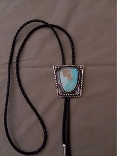 Sterling silver with turquoise bolo tie Artisan Silver Lariat Bolo Tie, Silver Lariat Bolo Tie With Adjustable Length, Silver Lariat Bolo Ties With Adjustable Length, Western Silver Bolo Tie With Sliding Knot, Blue Lariat Bolo Tie For Gift, Adjustable Southwestern Bolo Tie For Formal Occasions, Southwestern Style Adjustable Bolo Tie For Formal Occasions, Southwestern Style Formal Bolo Tie, Western Silver Lariat Bolo Ties