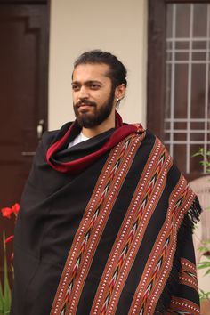 "These meditation hand-loomed shawls are made locally in a small village located in Himachal Pradesh, India. Each shawl has a layered border with intricately spooled geometric patterns done in different color as; browns, blacks, greys and reds. These shawls are great for meditation and to have after asana practice. When you learn and get to experience the sheer degree of detail and skill that is poured into every handwoven shawl, you begin to appreciate the beauty of the workmanship. It is no wo Traditional Handwoven Shawl For Festival, Traditional Brown Handloom Shawl, Black Bohemian Handloom Dupatta, Bohemian Black Shawl With Woven Motifs, Black Bohemian Shawl With Woven Motifs, Traditional Multicolor Handwoven Shawl, Traditional Handwoven Pashmina Shawl, Traditional Handwoven Shawl Scarf, Traditional Handmade Pashmina Shawl