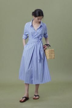 French Chic with Striped Shirt Dress Elegance Step into the world of French artistry with our Wrap Waist Stripe Shirt Dress. Made of 100% cotton, it boasts a delicate drape and smooth touch. The wrap waist design enhances its casual yet feminine vibe. Style #: WWSI368 Spring Stretch Shirt Dress, Blue Midi Dress For Summer Office Wear, Elegant Blue Cotton Shirt Dress, Fitted Light Blue Shirt Dress For Summer, Elegant Light Blue Shirt Dress For Spring, Blue Cotton Office Dress, Fitted Shirt Dress For Summer Office Wear, Light Blue Shirt Dress For Summer Workwear, Blue Fitted Shirt Dress For Work