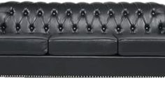 a black leather couch with buttons on the armrests and nail - tipped edges