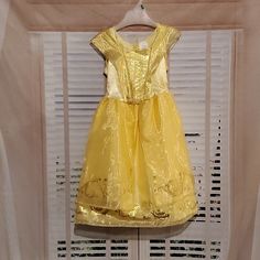 Beautiful Disney's Belle Ball Gown. Can Fit Sizes Between 4-6x. Has Sparkly Gold Glitter And Golden Metallic Design. Super Cute For Play Dress Or Even All Day Wear. Brand New With Out Tags! Perfect For Your Little Princess!! New With Out Tags No Rips Or Stains Smoke And Pet Free Home Color May Slightly Differ Due To Lighting Disney Princess Dress For Dress-up, Belle Ball Gown, Metallic Design, Belle Disney, Disney Costumes, Play Dress, Metal Design, Little Princess, Kids Costumes