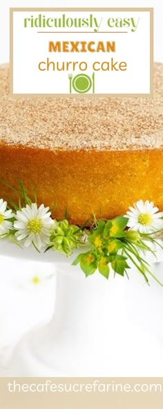 a close up of a cake on a plate with daisies and flowers around it