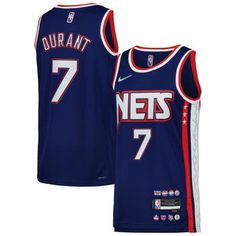 the new jersey for the basketball team is blue with red and white stripes on it