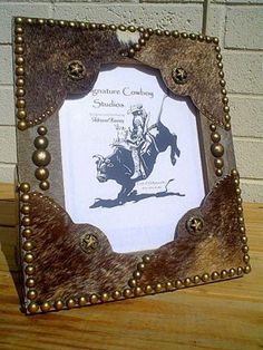 an old photo frame with a cowboy riding a horse