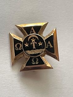 "This is a beautiful vintage 10 karat yellow gold and black enamel Alpha Tau Omega Greek society fraternity pin. The piece tests as 10 karat yellow gold. It is accented with beautiful black enamel. Back of the pin is markedWith the Greek symbols Epsilon Pi. It also reads the letters W. H. And the number 44186. It has a classic pin back in the role clasp works fine Piece measures 1/2\" x 1/2\".  It weighs 3.1 g This piece is an excellent preowned vintage condition. I do not see any signs of wear" Alpha Beta Omega, Omega Phi Alpha, Alpha Tau Omega, Greek Symbol, Fraternity, Black Enamel, Brooch Pin, Pins, 10 Things