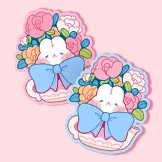 two stickers with flowers and bows on them, one has a cat in the middle