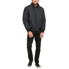 This wool bomber jacket with knit trim is a versatile coat that can be worn anywhere, from the boardroom to a night out on the town. It is a classic style that is sure to impress with its timeless look and sleek fabric. Heading to work or off the clock, keep warm while looking fashionably modern with this versatile bomber coat from Calvin Klein..Medium weight.Sits at waist.Regular fit.Stand collar; Zip-front closure.Single entry hand pockets with zipper closure.Inner channel quilt lining; Metal logo at back neck; Open cuffs with knit rib detail; Seam details at shoulder.Shell: Wool/polyester/nylon/acrylic/other fiber; Body lining: Nylon; Sleeve lining: Polyester.Dry clean only.Imported Winter Business Outerwear With Ribbed Cuffs, Classic Wool Varsity Jacket, Classic Wool Varsity Jacket With Ribbed Collar, Fitted Wool Varsity Jacket For Winter, Classic Wool Outerwear With Ribbed Collar, Wool Outerwear With Ribbed Collar For Fall, Classic Fitted Varsity Jacket For Winter, Classic Fall Sport Coat With Ribbed Cuffs, Winter Wool Varsity Jacket With Ribbed Collar