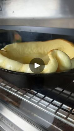 a pan filled with food cooking in an oven