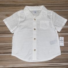 White Button Down Collared Shirt By Old Navy Is 100% Cotton But Has A Beachy, Linen Look. Adorable Fit. Brand New With Tags. Size: 6-12 Months Cotton Tops With Pockets For Playtime, Casual Tops With Pockets For Playtime, Short Sleeve Tops With Pockets For Playtime, White Buttoned Tops For Playtime, White Button Tops For Playtime, White Playtime Tops With Buttons, Short Sleeve Shirt With Button Closure For Playtime, Cotton Button-up Tops For Playtime, Summer Cotton Tops With Snap Buttons