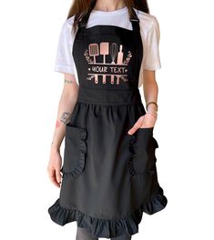 a woman wearing an apron that has cooking utensils on the front and back