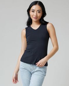 Indulge in the versatile elegance of our Reversible Tank. Crafted from our signature smooth tri-blend fabric, this tank offers a luxurious blend of modal, nylon, and spandex that drapes beautifully on the body. The reversible design allows you to effortlessly transition from a classic scoop neck to a chic V-neck. Fall Jeans, Swim Trends, V Neck Tank Top, One Piece Suit, Sweater Sale, Knee Length Dresses, Jacket Sale, Jeans Dress, Special Occasion Dresses