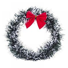 a black and white wreath with a red bow on the top, surrounded by tinsel