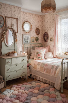 a bed room with a neatly made bed next to a dresser and mirror on the wall